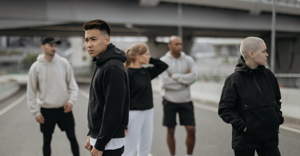 A diverse group of friends wearing activewear in an urban setting. Ideal for lifestyle and sports themes.